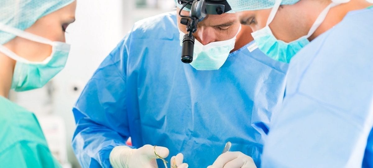 Hospital - surgery team in the operating room or Op of a clinic